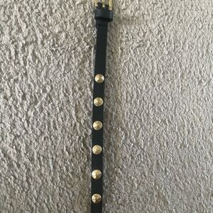 Black belt with gold studs. Please see measuring tape photo for exact inches.